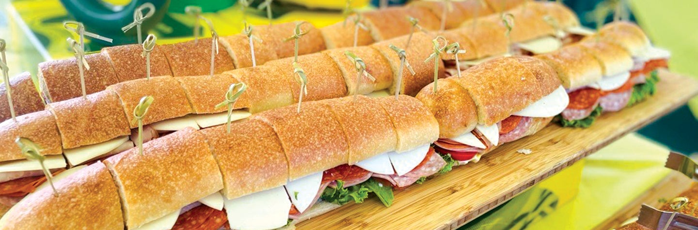 Subway sandwiches ready to go into boxed lunches.