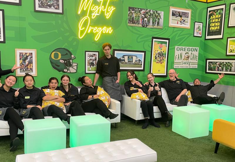 Catering staff in photo in Mighty Oregon lounge.